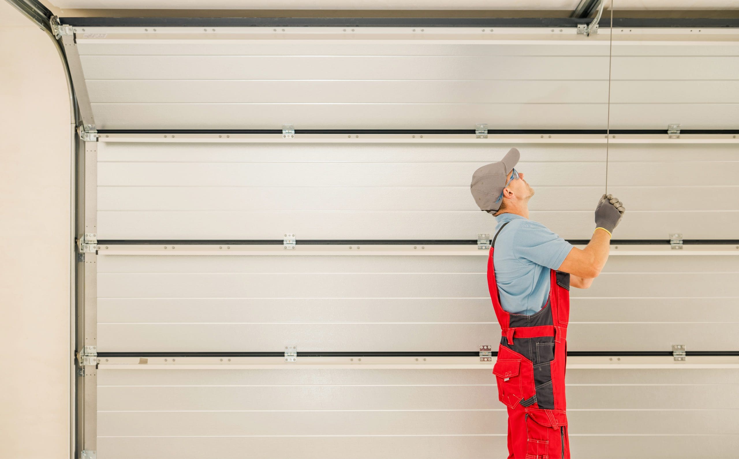 Balance Check for white Residential Garage Door after installation.