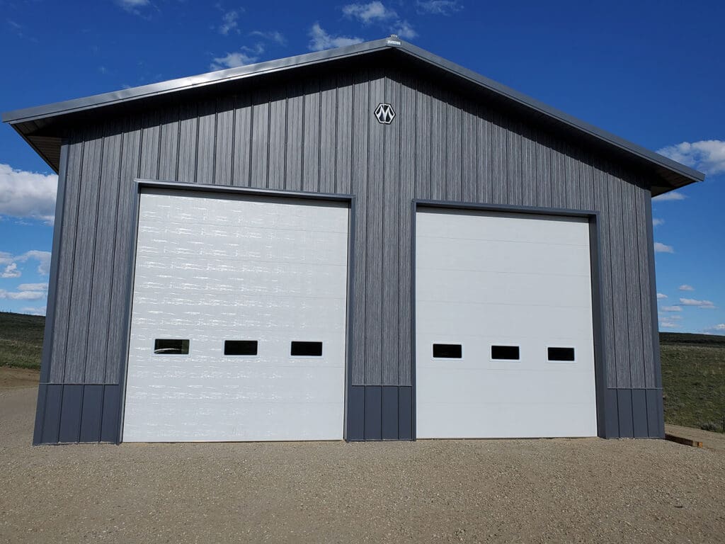 Two updated white commercial garage doors