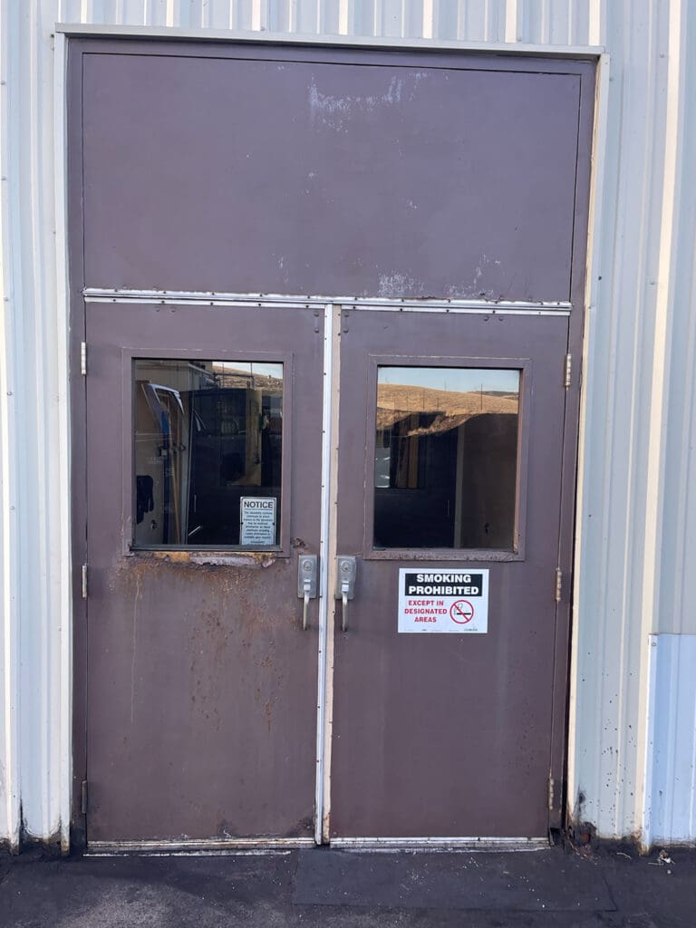 Before of old commercial double doors