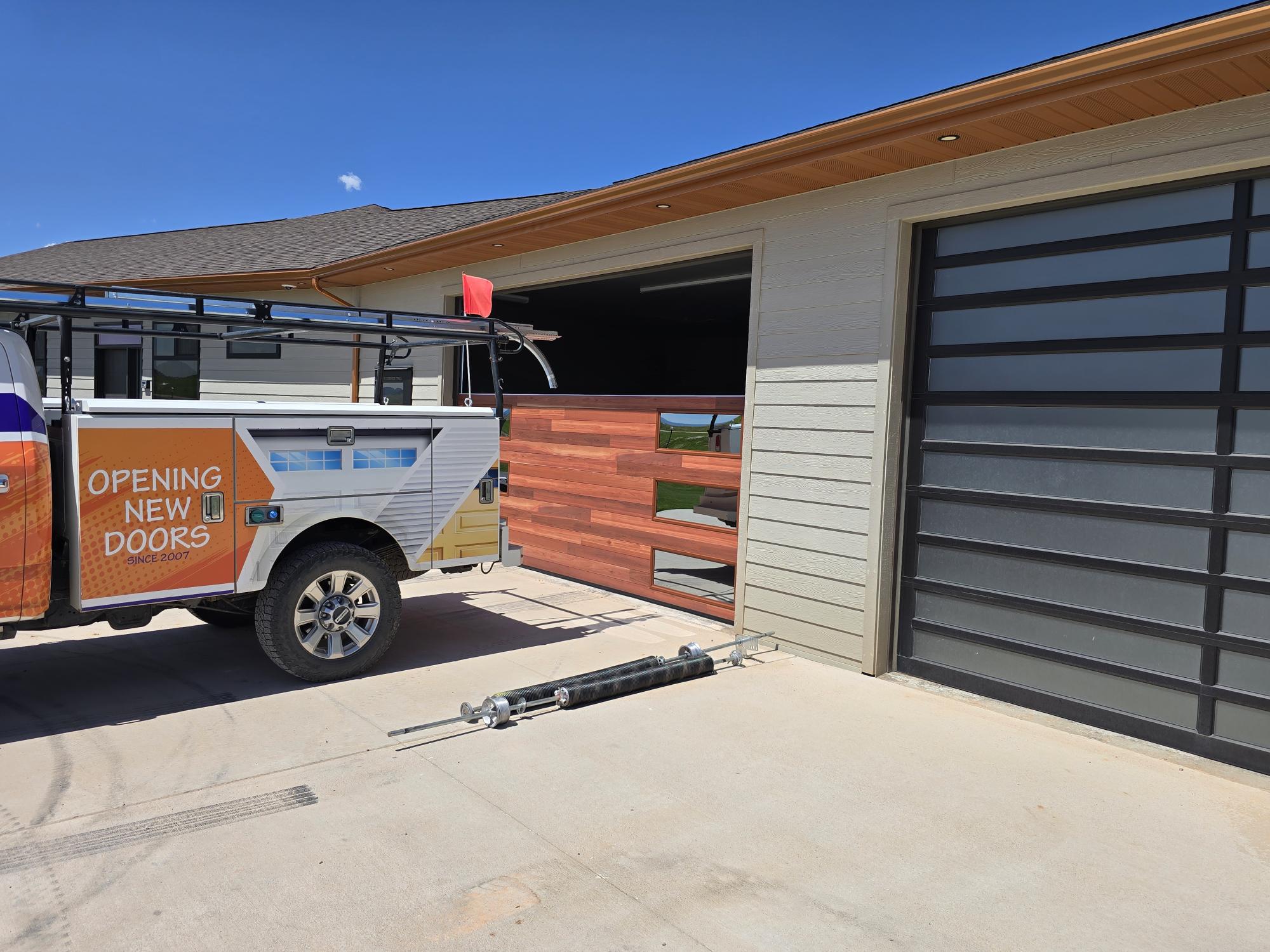 Image of residential garage door being worked on by Architectural Specialties in Rapid City