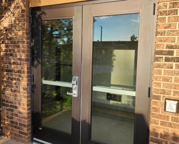 Close Up of Newly Installed Glass and Aluminum Door with Keypad Access Control