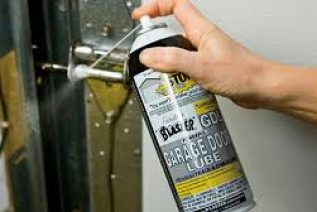 Can of Blaster Garage Door Lubricant for Residential Garage Door Maintenance Tips.