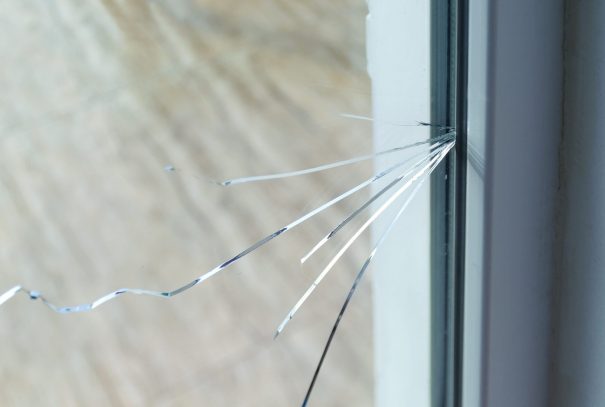 Cracked glass window in home.